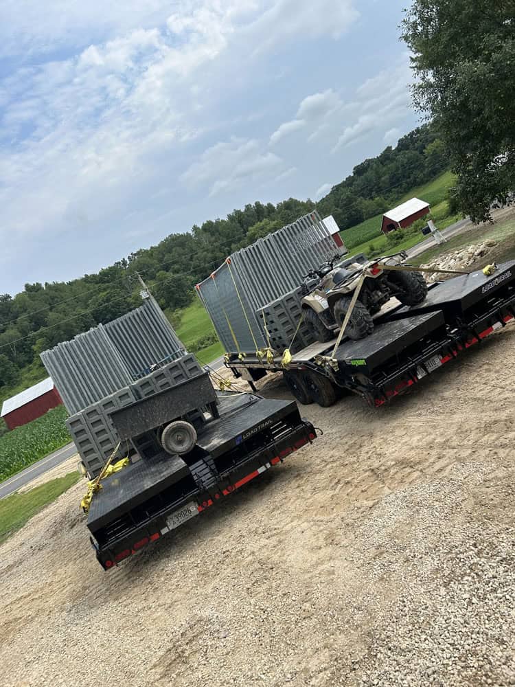 trailers loaded up and ready to go with temp fencing