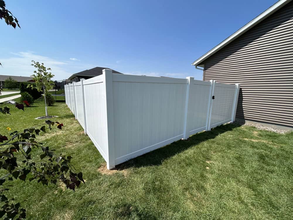 new white vinyl fence installation on a La Crosse area home