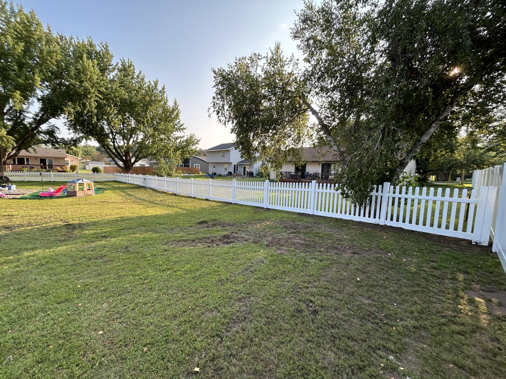 White vinyl picket fence - residential fence installation