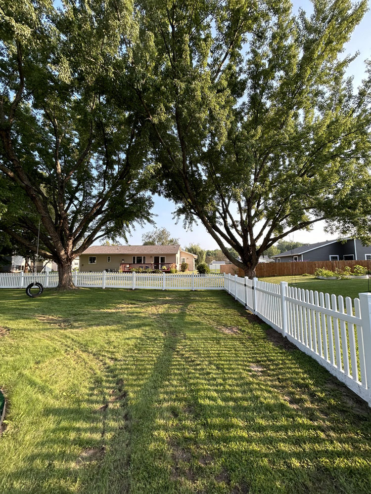 White vinyl picket fence - residential fence installation