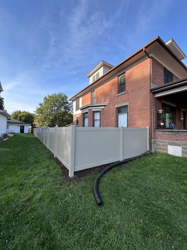 Tan vinyl fence - residential fence installation