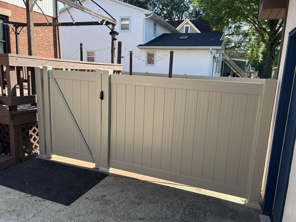 Tan vinyl fence - residential fence installation