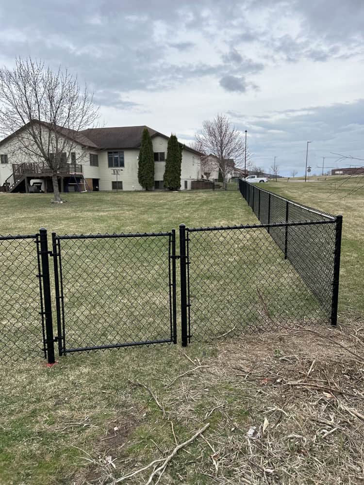 chain link perimeter fence install by Flyway Fence Co
