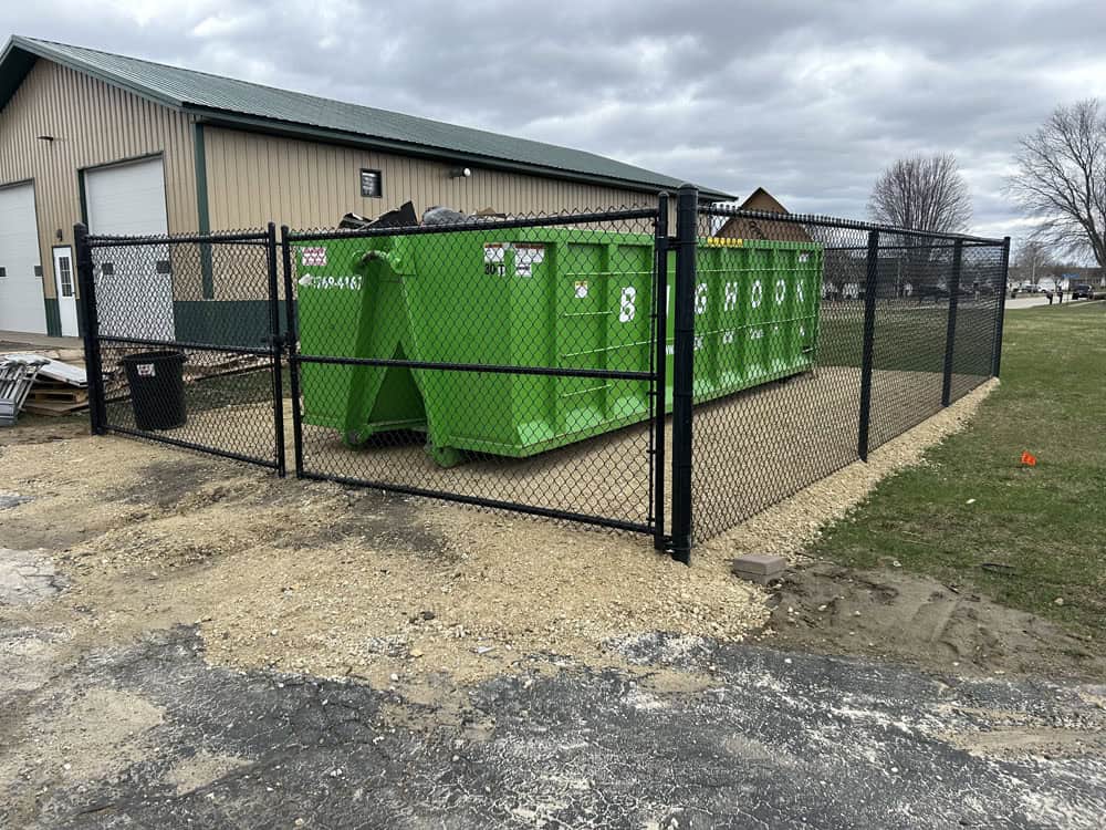 chain link fence installed to secure dumpster access