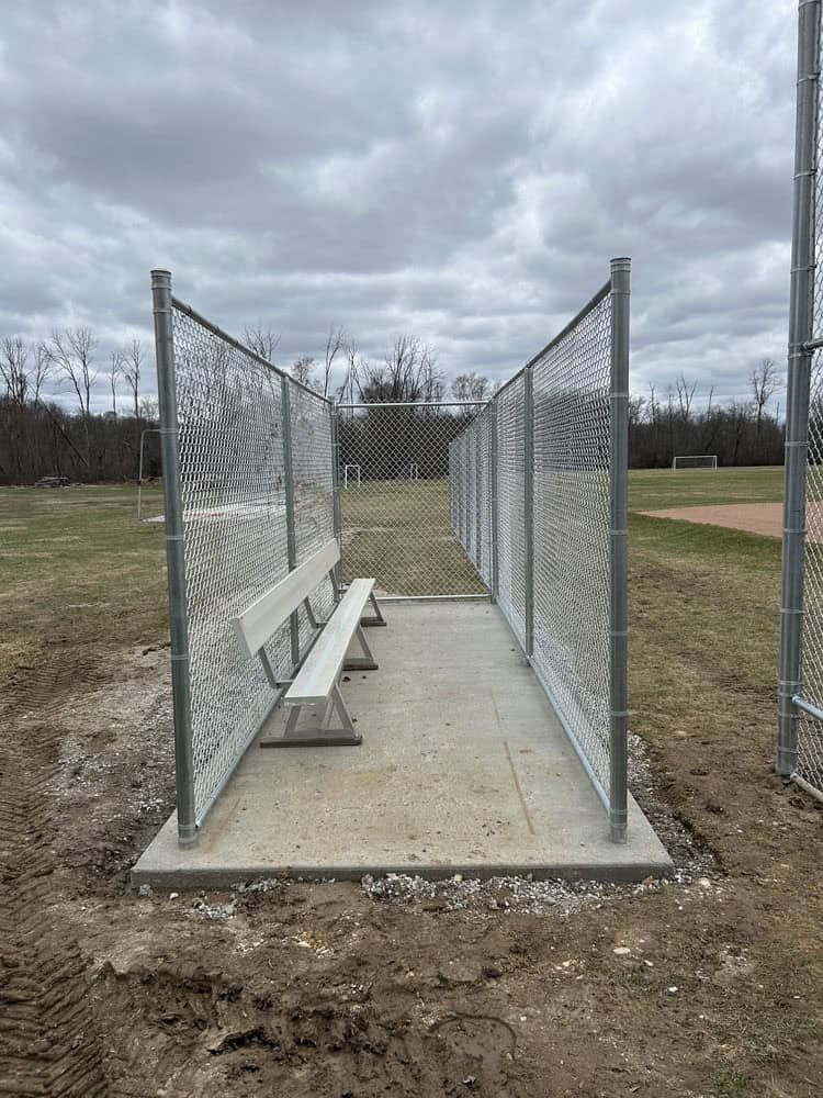 Chain Link fencing installation by Flyway Fence Co - ball park team bench