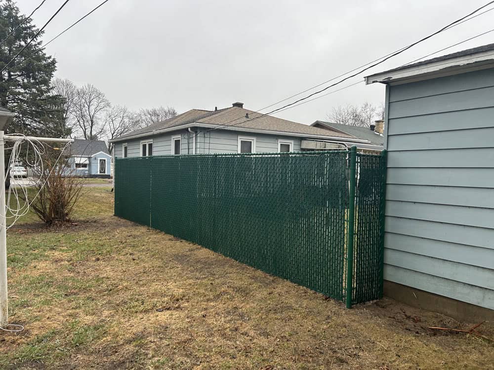 residential chain fence installation with privacy