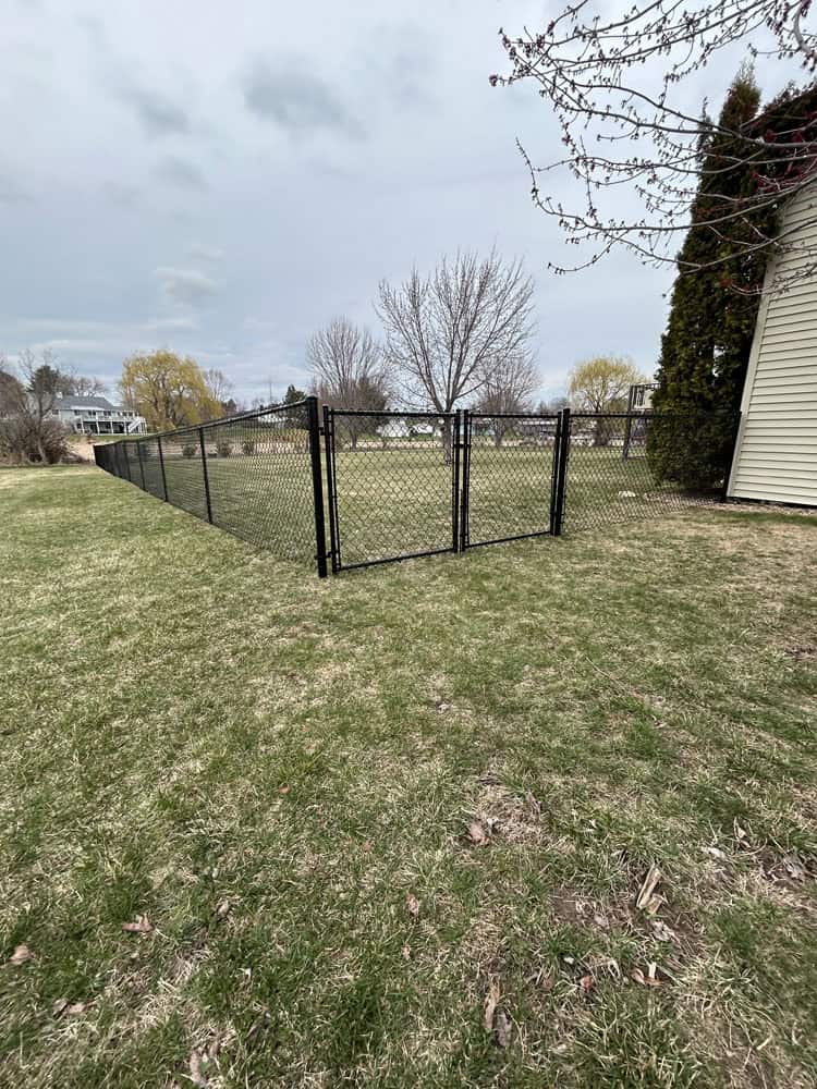 chain link perimeter fence install by Flyway Fence Co