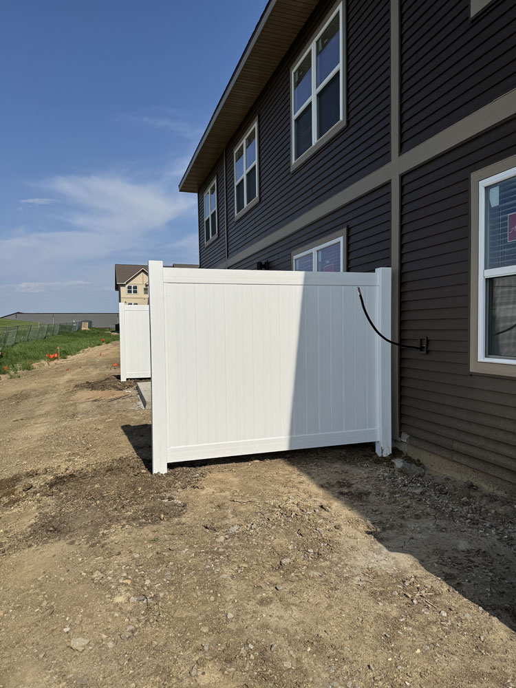 White Vinyl Fence installed as a privacy barrier