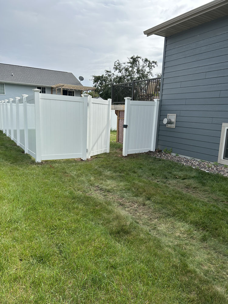 White Vinyl Fence installed with gate